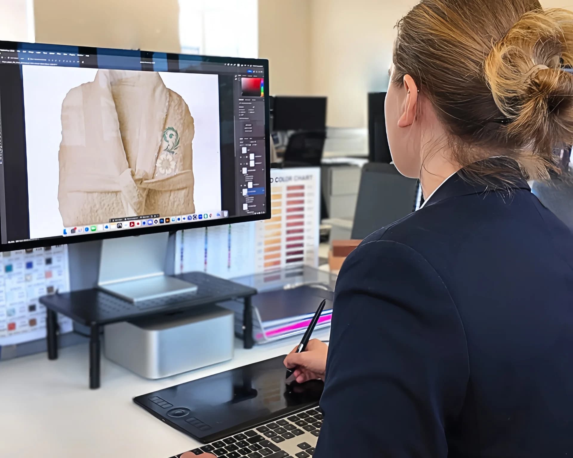 A designer sketching a bespoke tableware design.