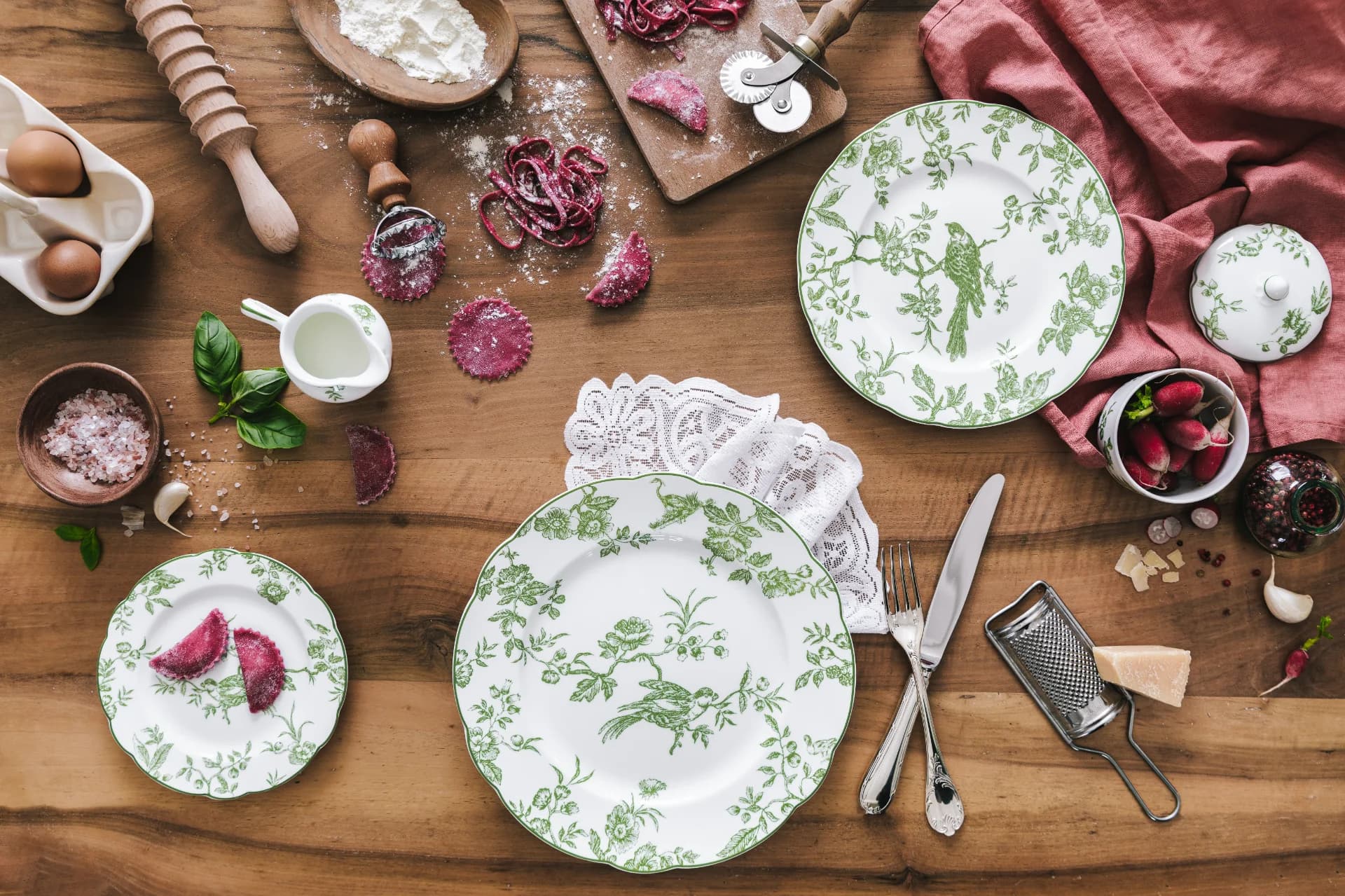 A stack of fine bone china plates with intricate designs.