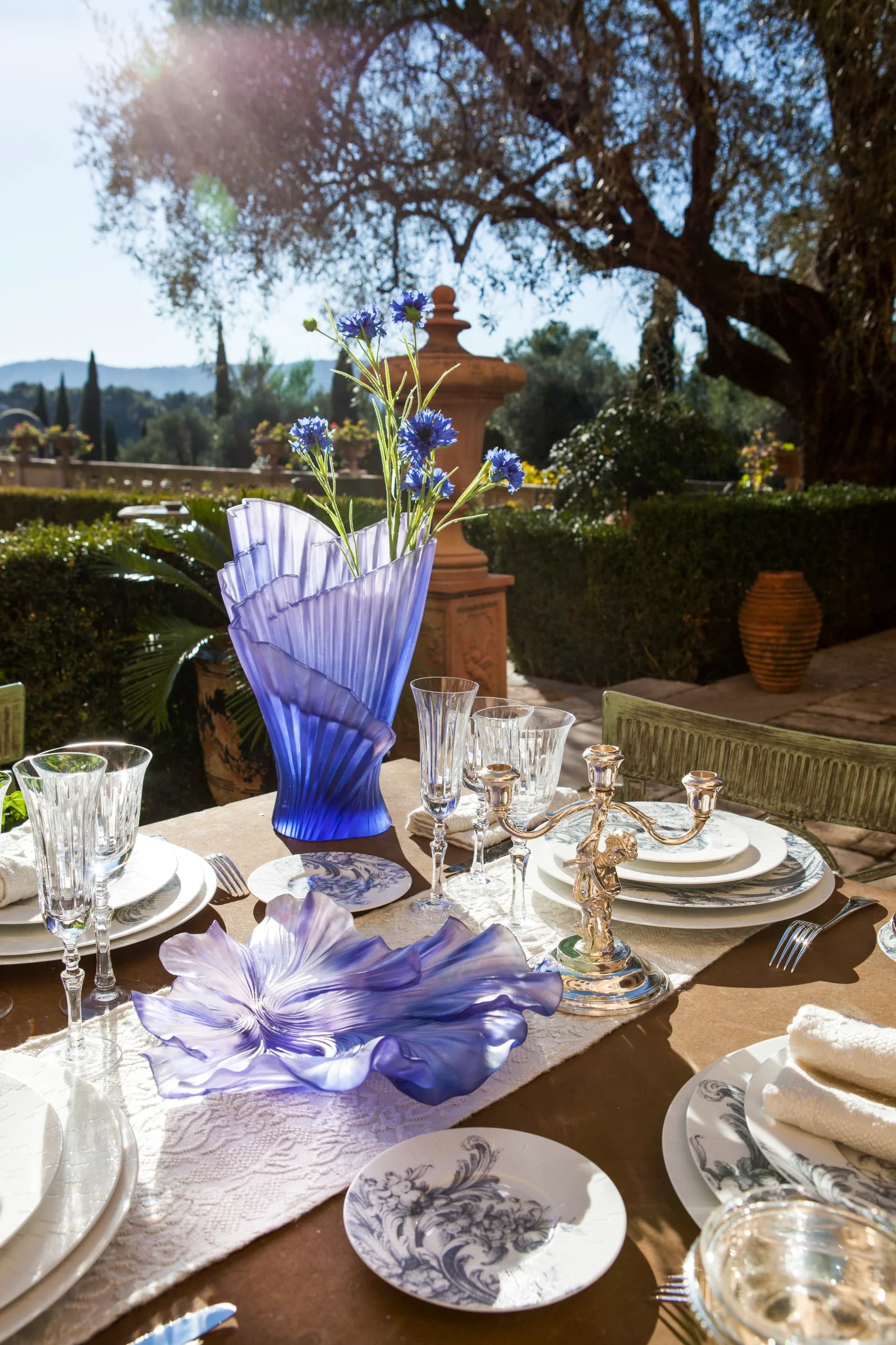 A stylish interior with decorative vases and sculptures.