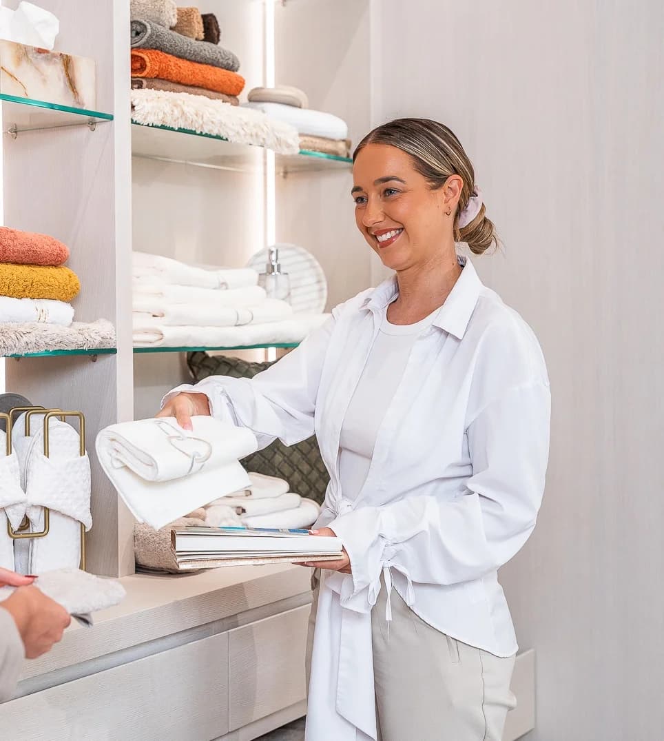 Rachael From The GF Team Reviewing Hand Embroidered Towels And Luxury Bathroom Linens