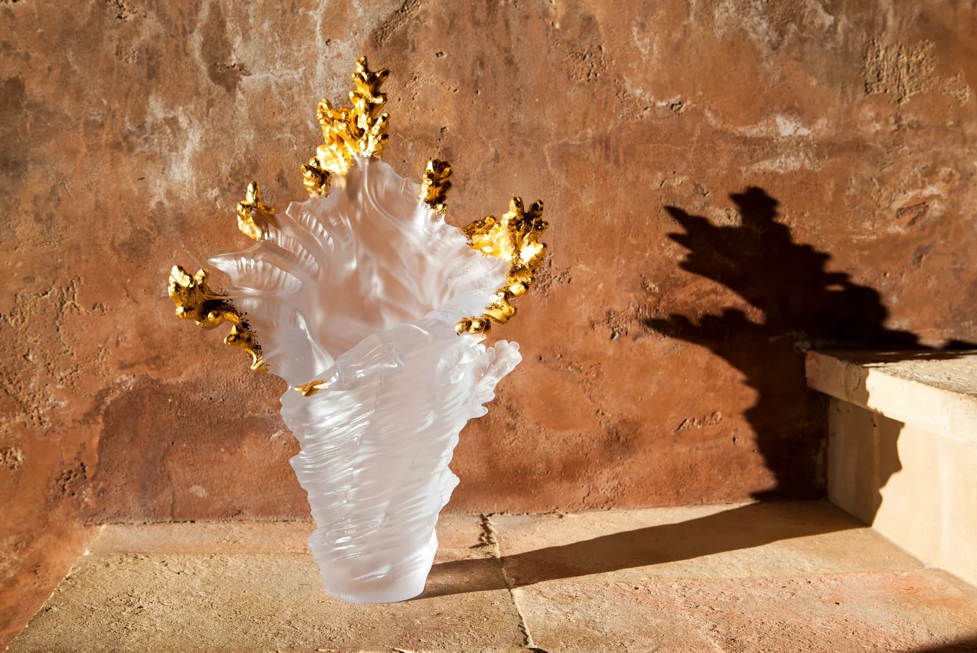 A collection of luxury accessories including leather goods and decorative items.